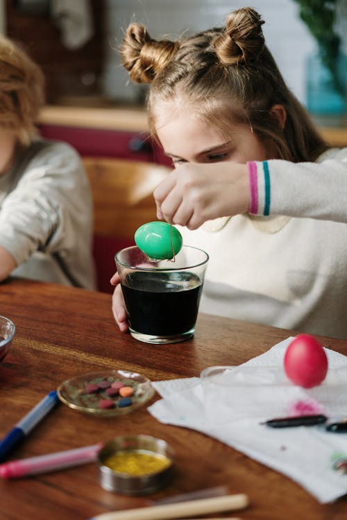 Girl Making Green Easter Egg