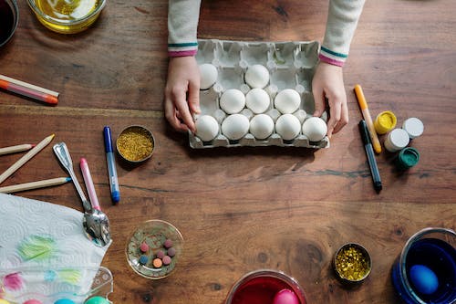 Person Holding White Egg Tray