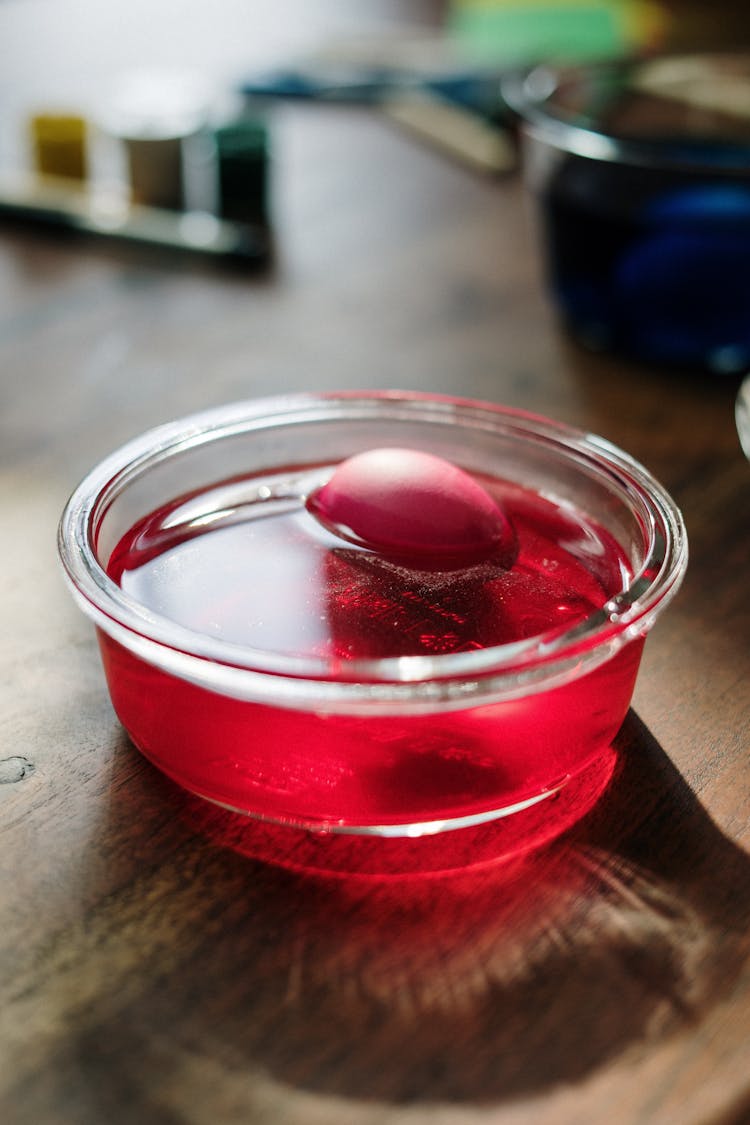 Egg Dip In Red Liquid For Easter