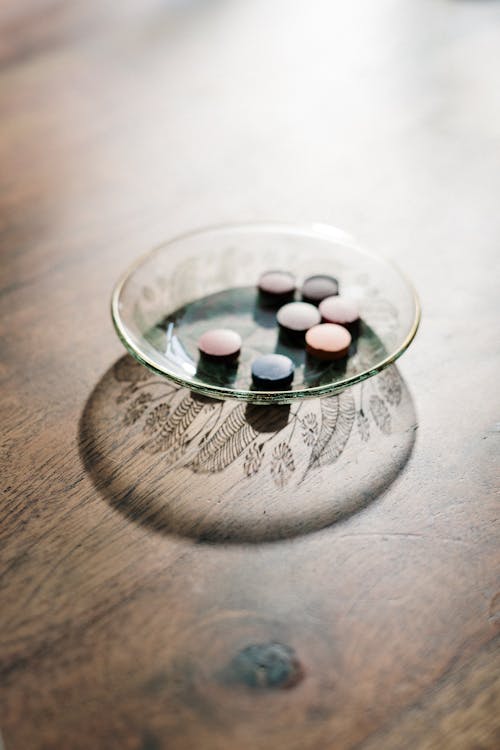 Free White and Red Medication Pill on Clear Glass Bowl Stock Photo
