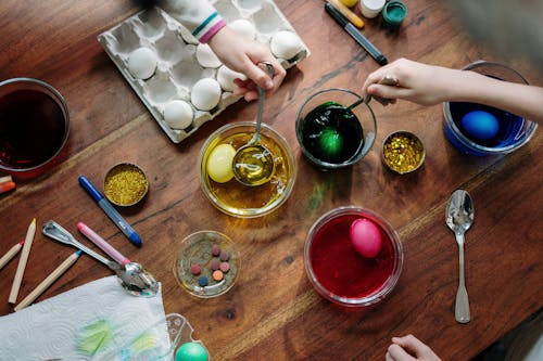 Free Eggs Dip on Colorful Liquids Stock Photo