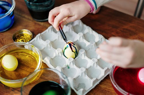Free Person Making Tie Dye Easter Egg Stock Photo