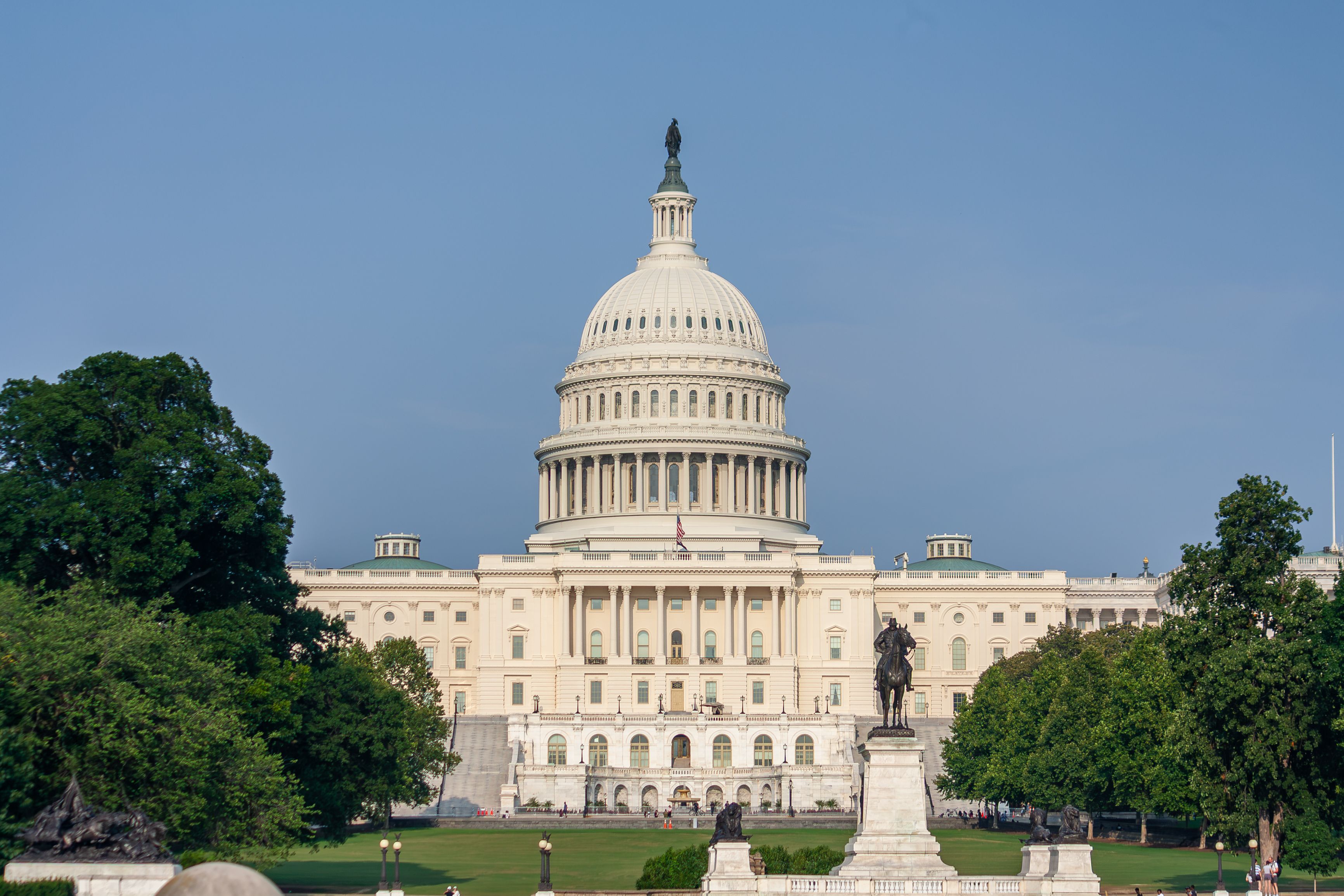 Captivating view of the US Capitol Building in Washington D.C. against a clear blue sky.
