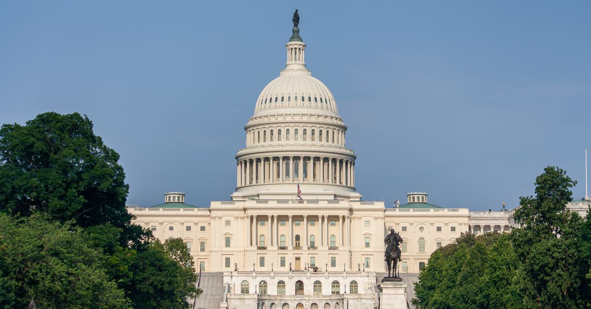 Captivating view of the US Capitol Building in Washington D.C. against a clear blue sky.