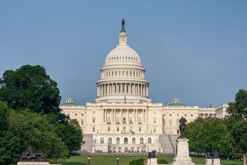 Free The iconic United States Capitol Building in Washington D.C. under a clear blue sky. Stock Photo