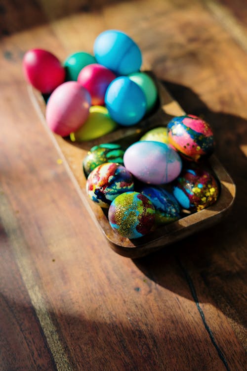 Free Assorted Easter  Eggs on Brown Wooden Tray Stock Photo