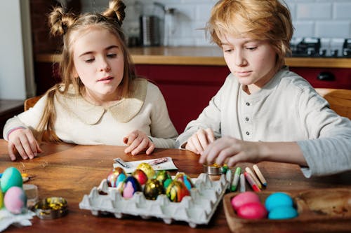 Free Children Decorating Easter Eggs Stock Photo
