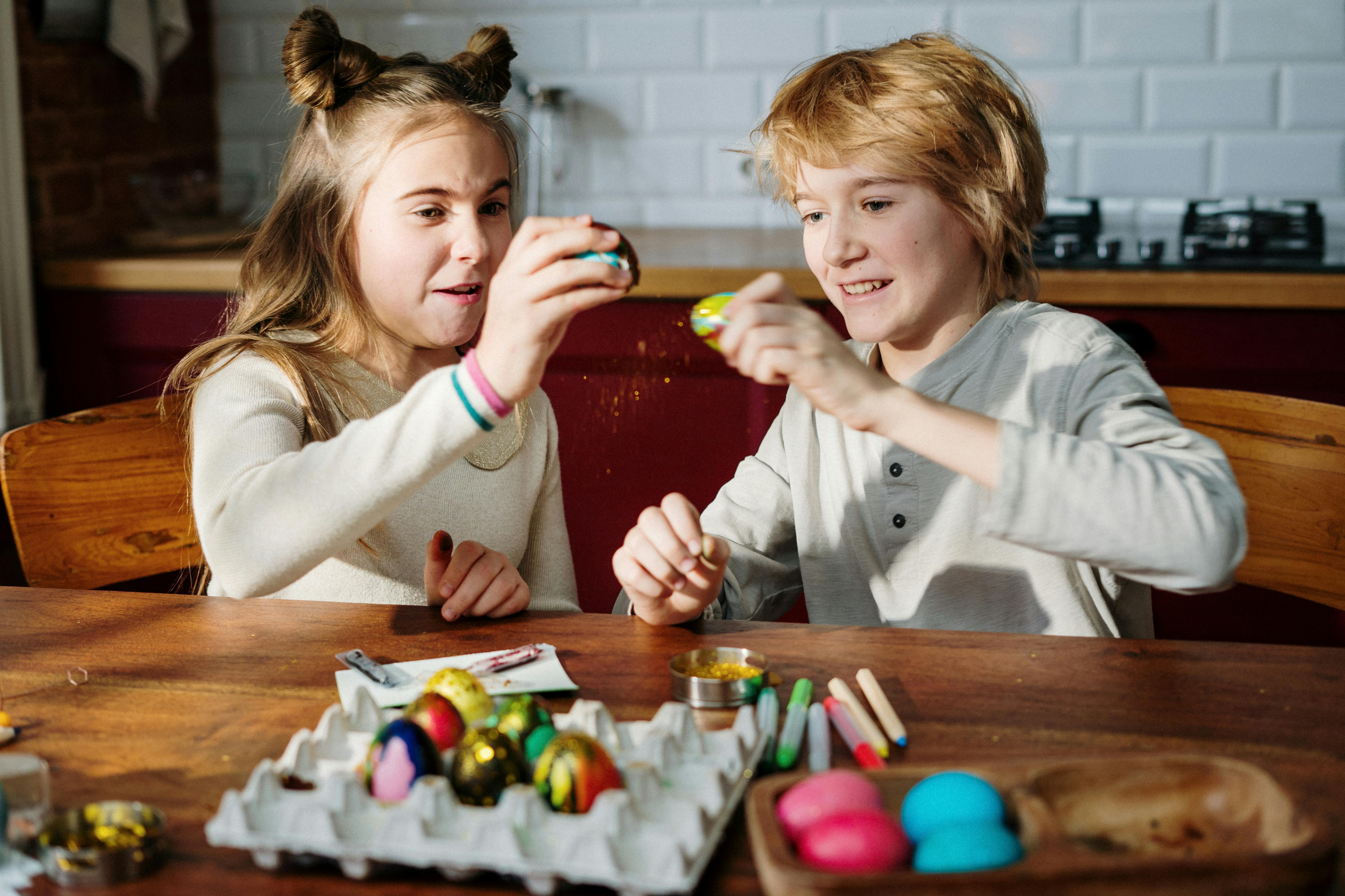 girl in white long sleeve shirt playing with other girls