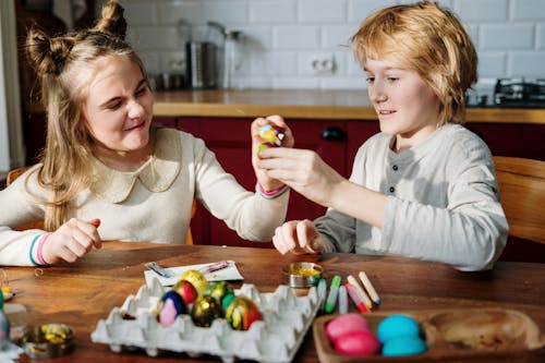Free Kids Having Fun with Easter Eggs Stock Photo