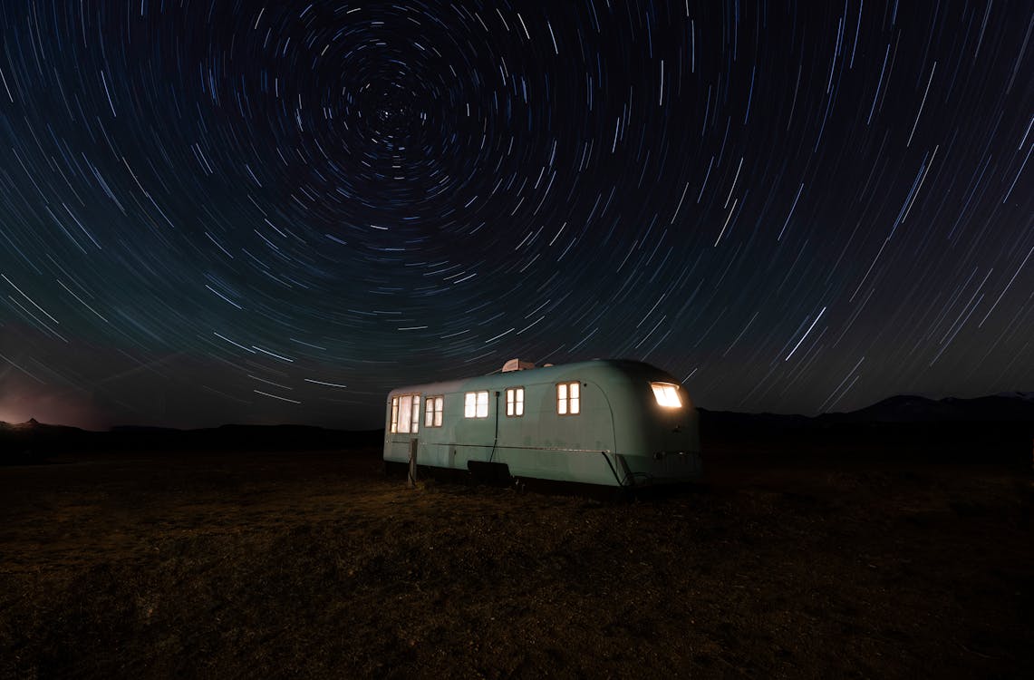 Free White and Gray Camper Trailer Under Starry Night Stock Photo