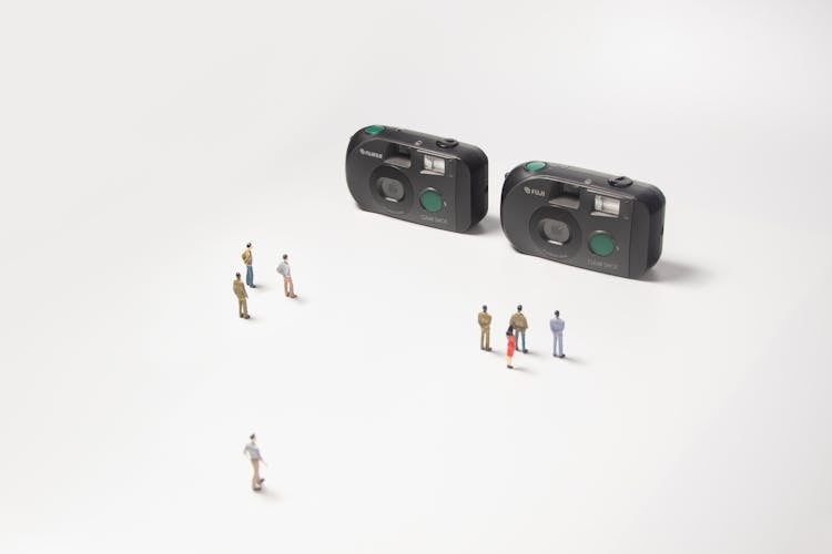 Analog Cameras And Miniature Human Figures