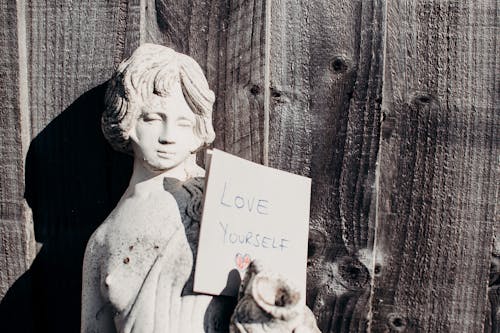 Love Yourself Card On Statue