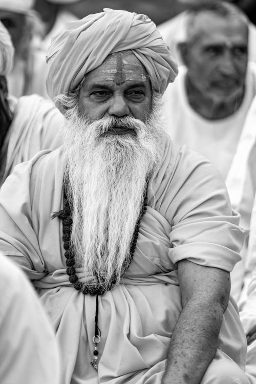 Free Black and white portrait of an elderly Indian man wearing traditional clothing and a long white beard. Stock Photo