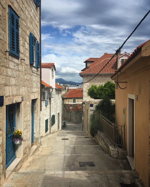 Free Explore a narrow stone street in the picturesque medieval town of Split, Croatia. Stock Photo