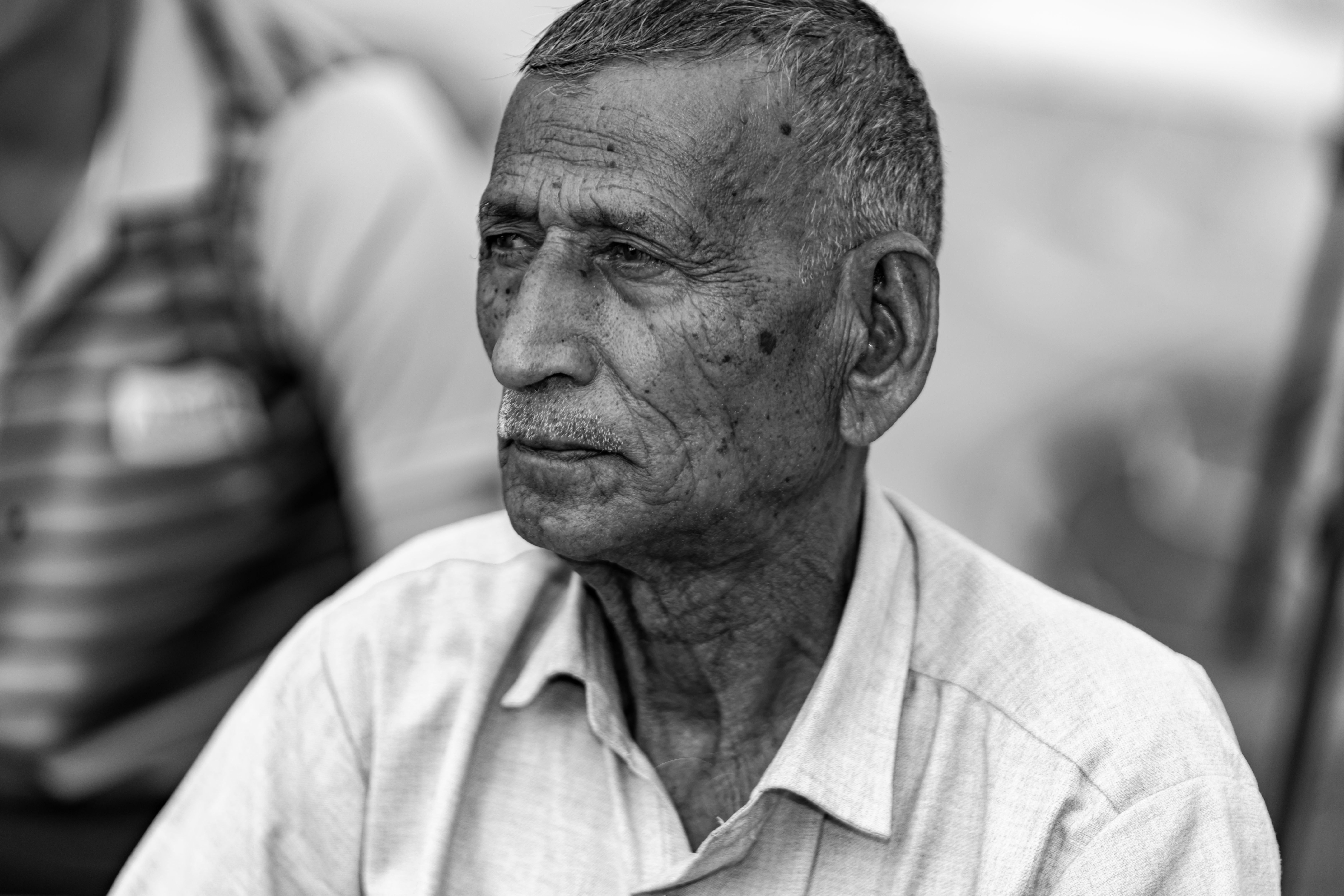 Monochrome portrait of an elderly man from Rajasthan showcasing deep emotions and cultural heritage.