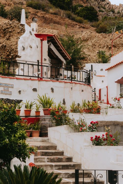 Free Scenic view of traditional architecture with potted plants in Vallehermoso, Canary Islands. Stock Photo