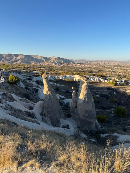 Free Explore the unique rock formations at sunset in the stunning Cappadocia, Türkiye. Stock Photo