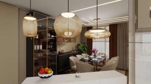 Free Stylish dining room featuring a glass table, pendant lighting, and cozy chairs. Stock Photo