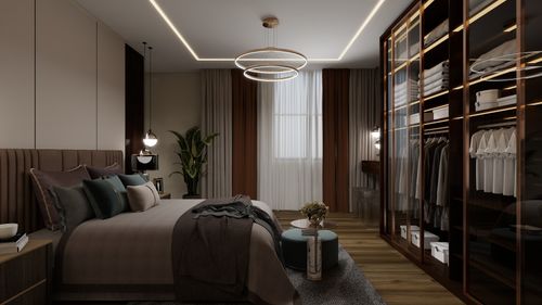 Free Stylish bedroom interior featuring contemporary furniture and a chic walk-in closet. Stock Photo