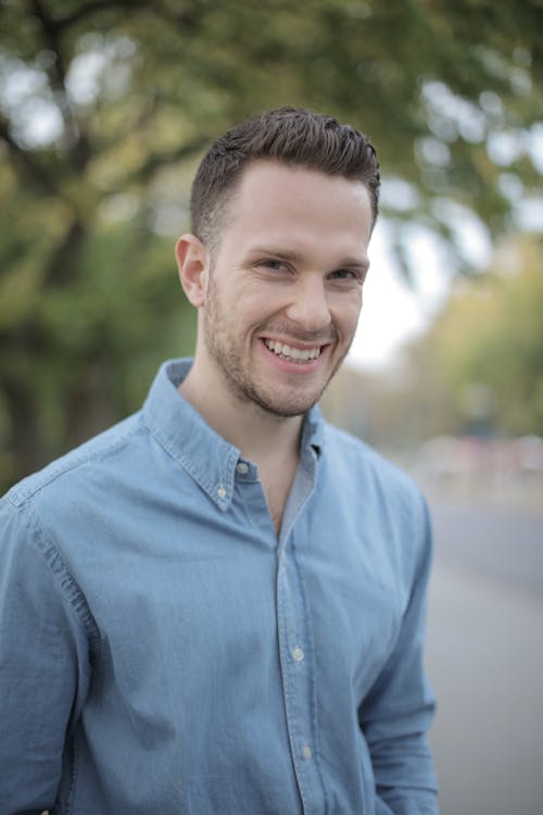 Man in Blue Dress Shirt Smiling