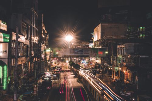 Free Long exposure photo capturing the bustling nightlife and bright streetlights of Rajshahi, Bangladesh. Stock Photo