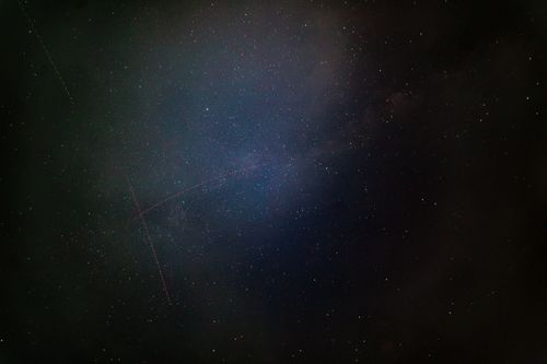 Free Depiction of a starry night sky, revealing a faint glimpse of the Milky Way galaxy. Stock Photo