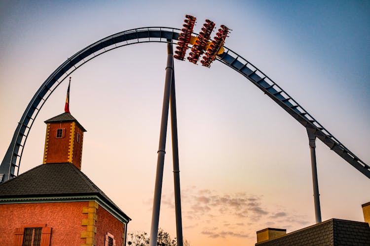 People Riding The Roller Coaster