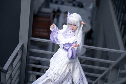 Free A cosplay enthusiast poses in an elegant lavender and white fantasy costume with elf ears. Stock Photo