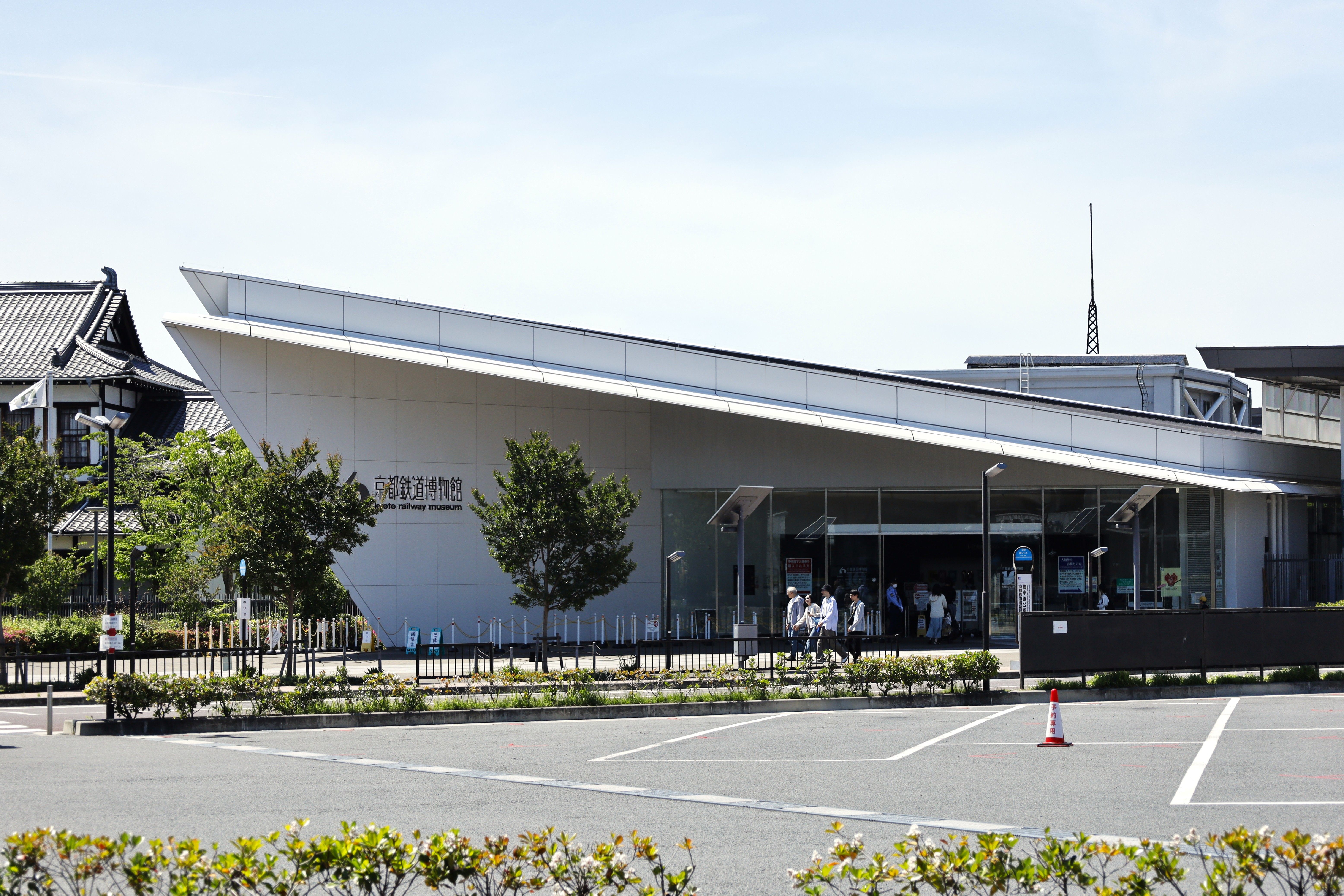 Modern architectural view of Kyoto Railway Museum on a sunny day.