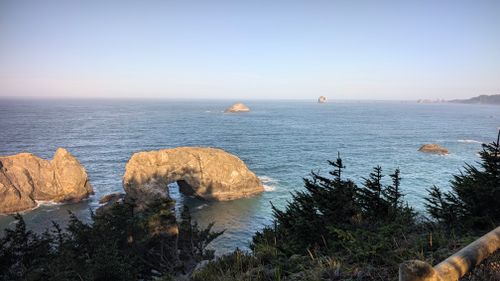 Free Breathtaking view of a rocky natural arch along the serene Oregon coast during daytime. Stock Photo