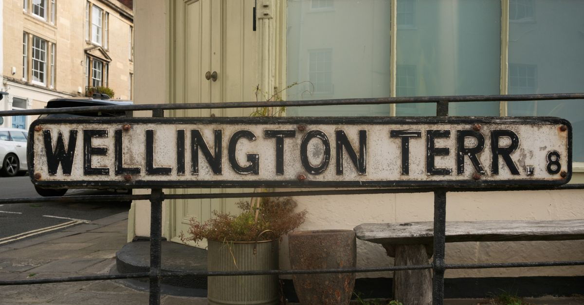 Rustic street sign for Wellington Terrace in Bristol, England showing an old-world charm.