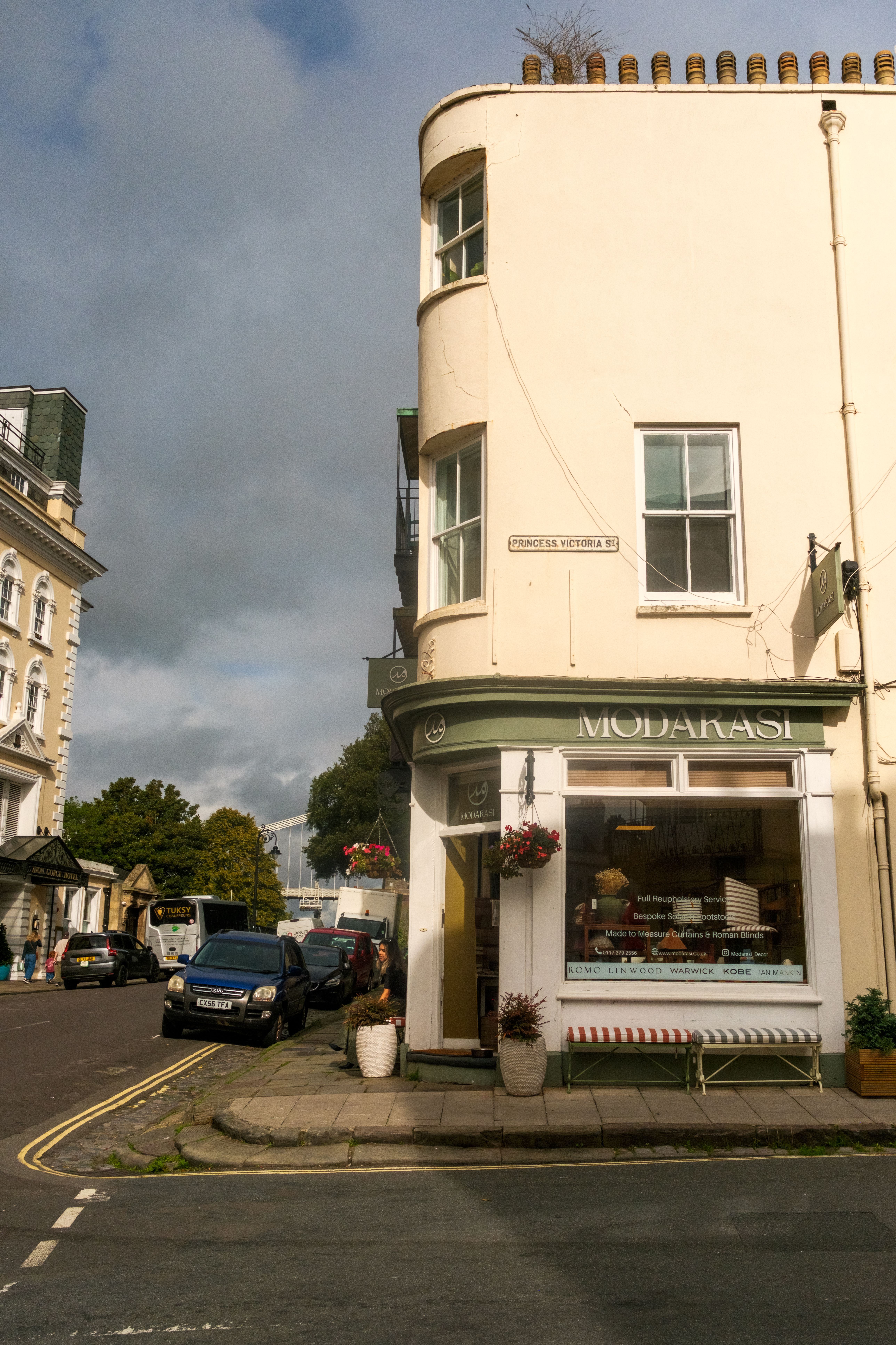 Quaint street corner with a café in Bristol, England, capturing local charm.