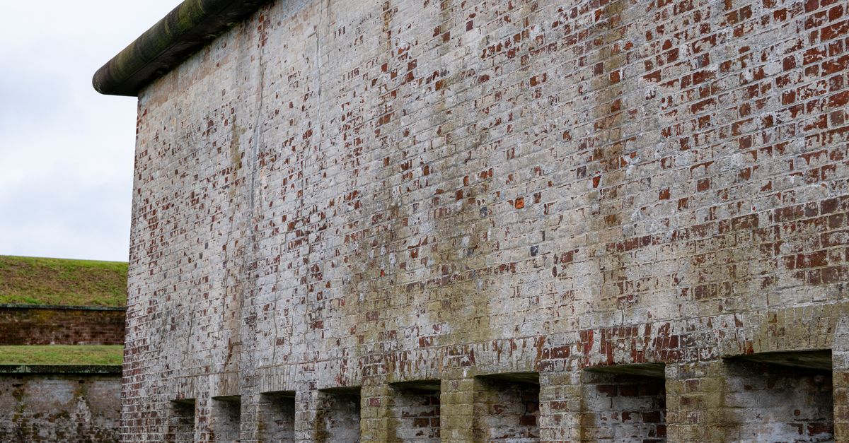 Close-up of Fort Macon's weathered brick wall in Atlantic Beach, North Carolina.