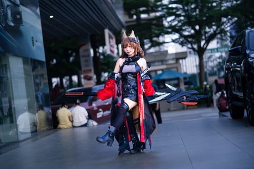 Free Cosplayer wearing elaborate costume poses with futuristic props in an urban environment. Stock Photo