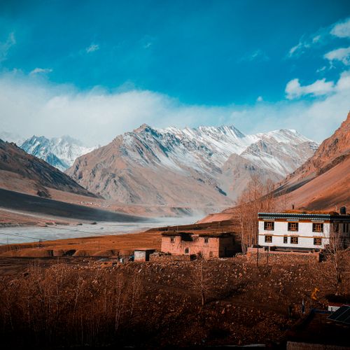 Free Picturesque view of the Himalayas and traditional village house in India. Stock Photo