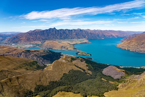 Mountainous coastline of turquoise sea on sunny day