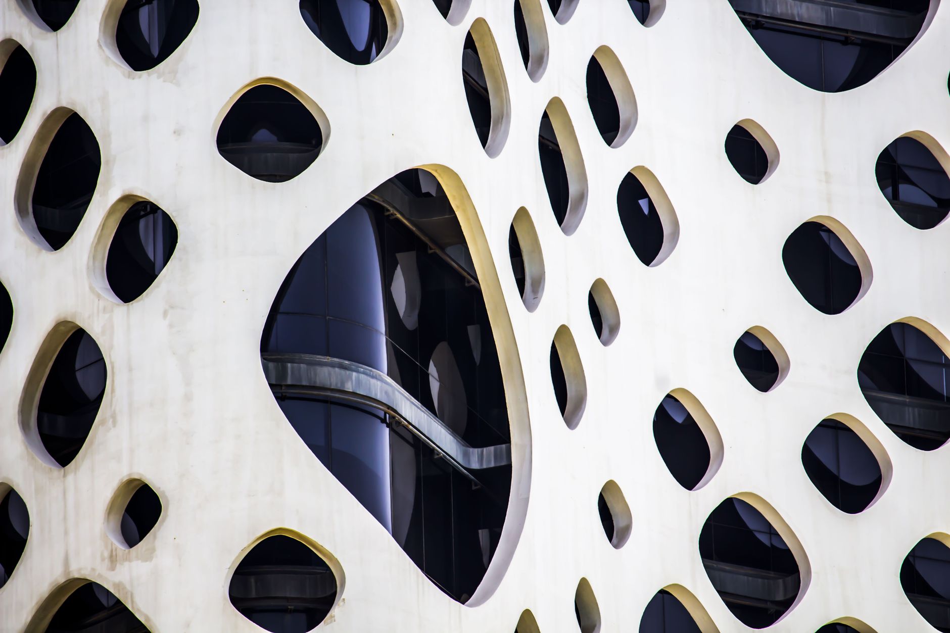 Seven geometric forms connected under architectural canopy representing UAE emirates