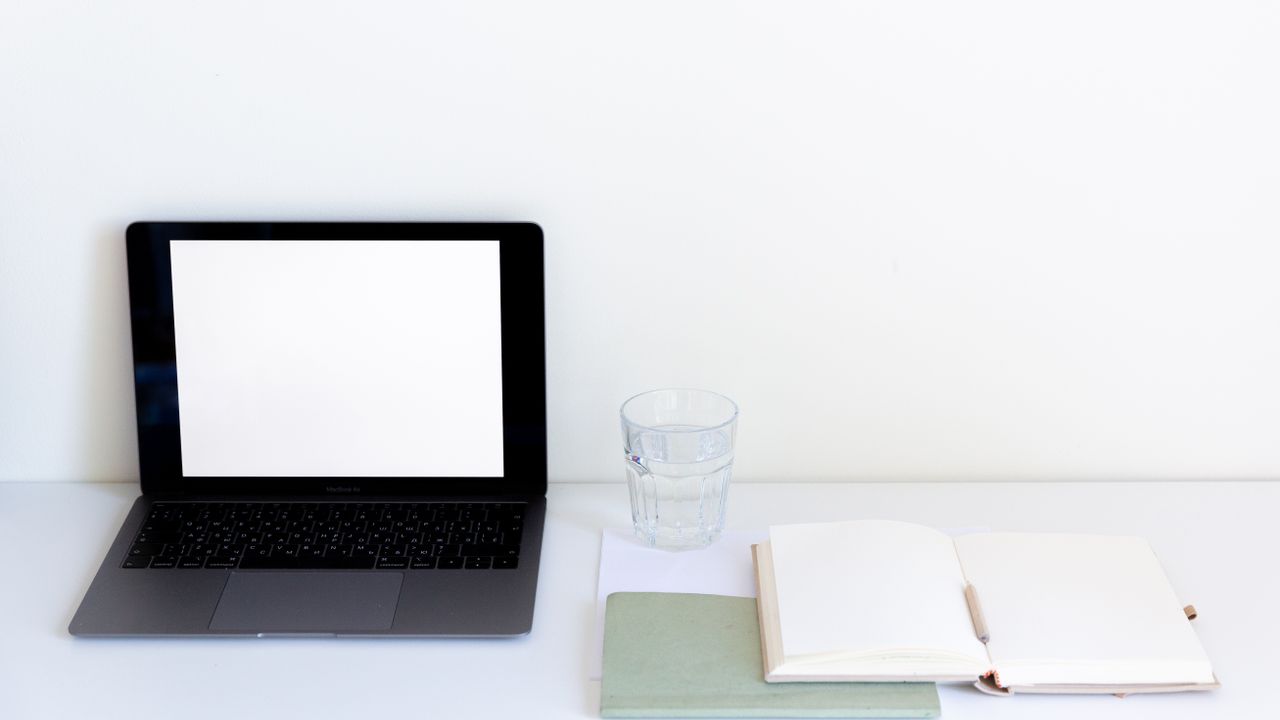 Simple daily routine planning Laptop notebook and daily planner used to design a simple productive routine
