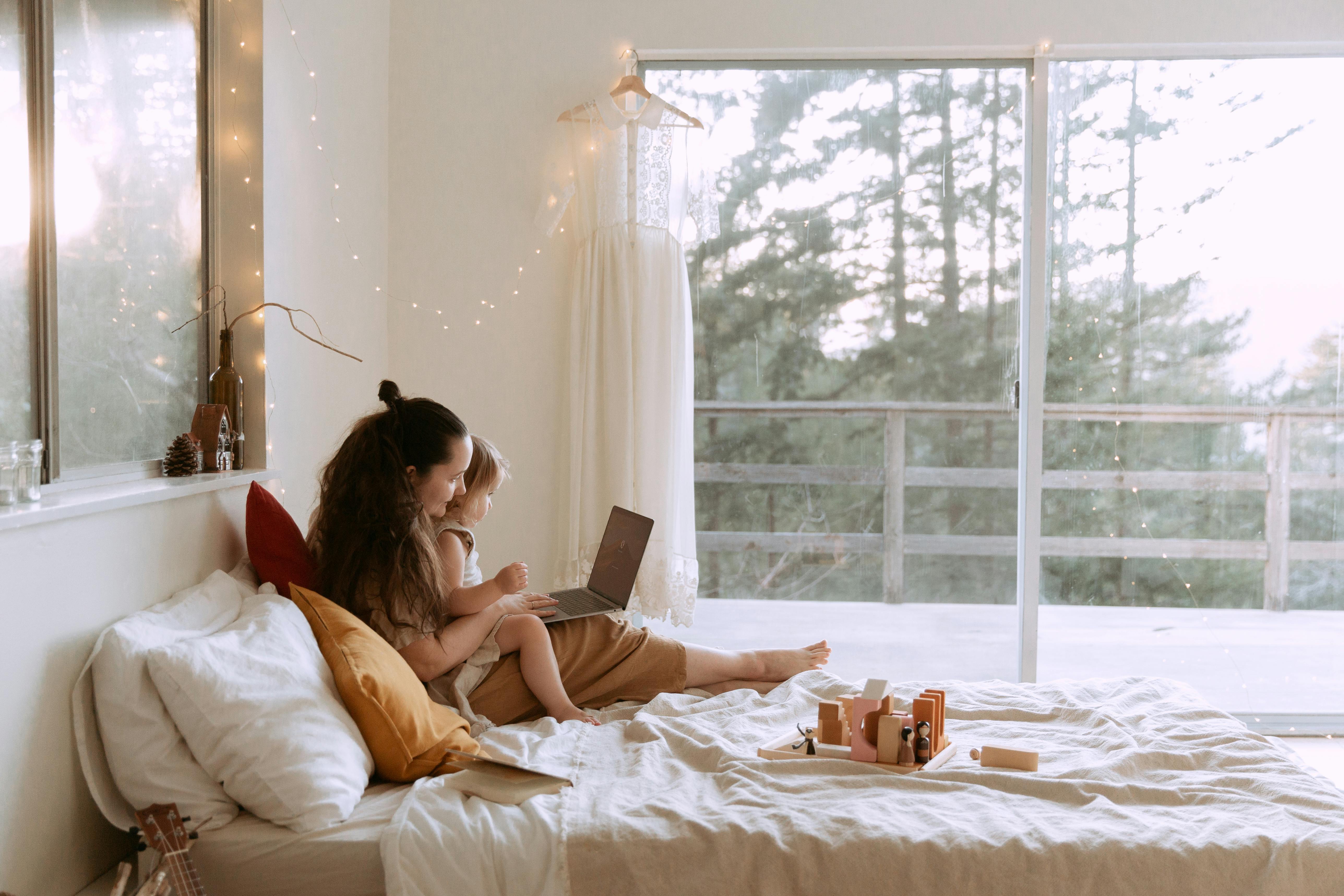 mother and baby using a laptop together