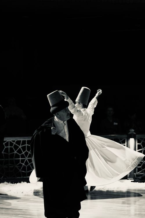 Free A captivating black and white photo of a traditional Sufi whirling dance performance. Stock Photo