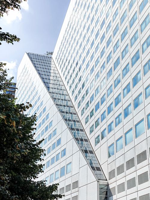 Free Contemporary skyscraper with glass facade in Rotterdam, Netherlands. Stock Photo