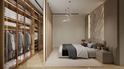 Free Elegant bedroom with a spacious walk-in closet and modern design elements. Stock Photo