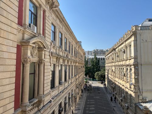 Free View of historic buildings in Baku, Azerbaijan under a clear blue sky. Stock Photo
