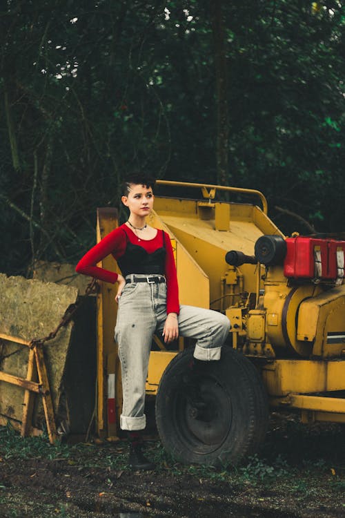 Woman Standing Beside A Tractor