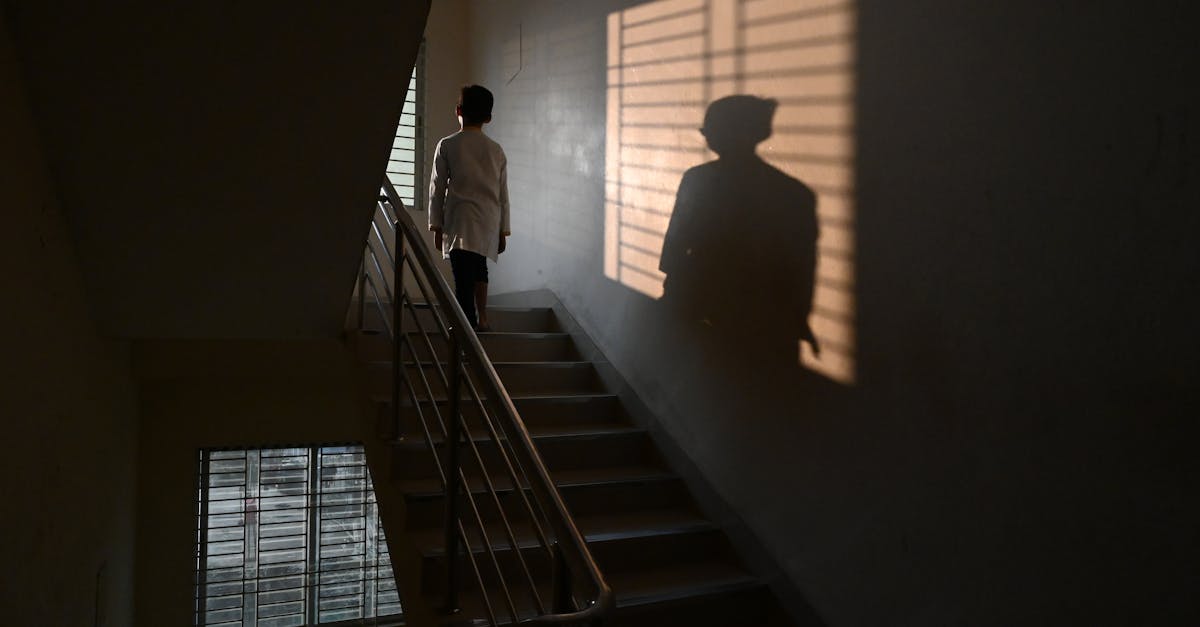 Person Standing On Staircase · Free Stock Photo