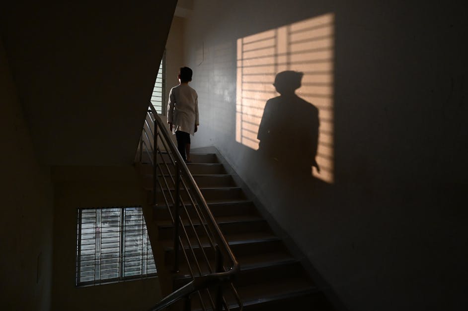 Person Standing On Staircase · Free Stock Photo