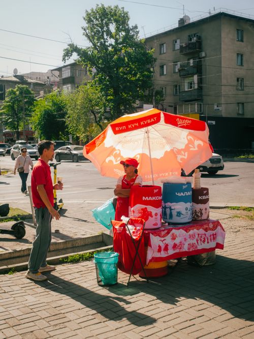 Free A street vendor selling traditional Kyrgyz drinks on a sunny day in Bishkek, Kyrgyzstan. Stock Photo