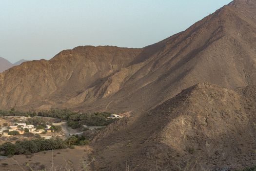 Breathtaking view of rugged mountains in Khor Fakkan, Sharjah, UAE, capturing natural beauty at dawn.