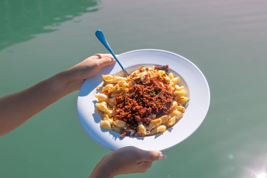 Enjoying a delicious seafood pasta platter in sunny Corpus Christi, Texas.
