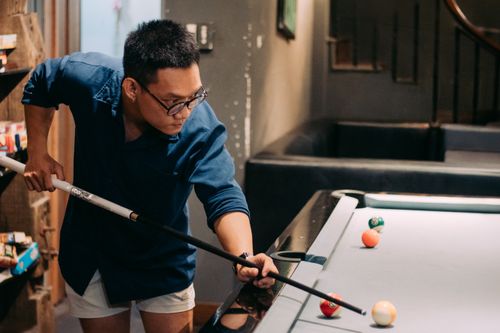 Free Young man playing billiards in a cozy indoor setting in Ho Chi Minh City, Vietnam. Stock Photo